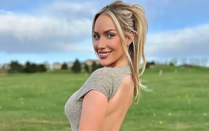 Paige Spiranac wearing a Willy Wonka-inspired Halloween costume during a golf challenge